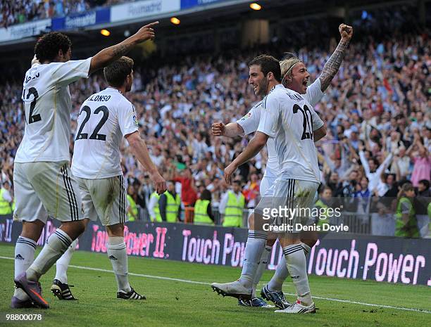 Marcelo , Xabi Alonso Gonzalo Higuain and Guti of Real Madrid celebrate after Real scored their 3rd goal during the La Liga match between Real Madrid...