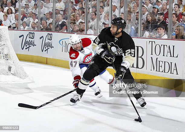 Maxime Talbot of the Pittsburgh Penguins looks to pass in front of Marc-Andre Bergeron of the Montreal Canadiens in Game Two of the Eastern...