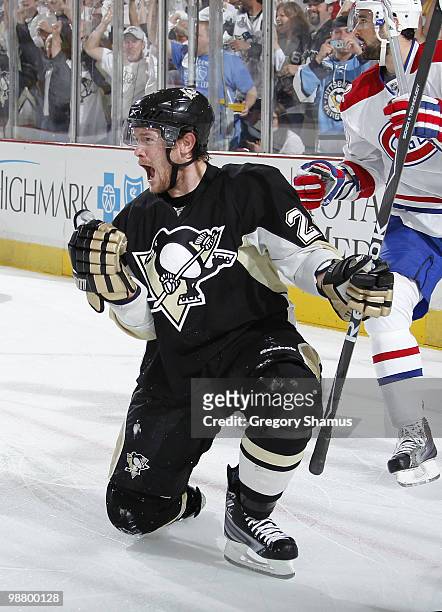 Matt Cooke of the Pittsburgh Penguins celebrates his goal in front of Ryan O'Byrne of the Montreal Canadiens in Game Two of the Eastern Conference...