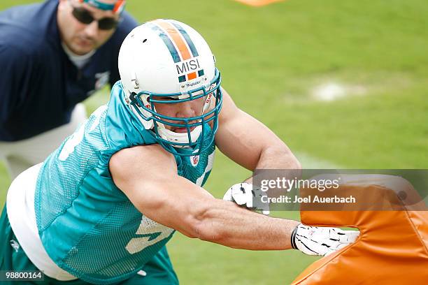 Koa Misi of the Miami Dolphins practices with a tackling dummy during the rookie mini camp May 2, 2010 at the Miami Dolphins training facility in...