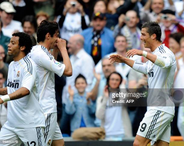 Real Madrid's Portuguese forward Cristiano Ronaldo celebrates wth teammate Real Madrid's Brazilian midfielder Kaka against Osasuna during their...