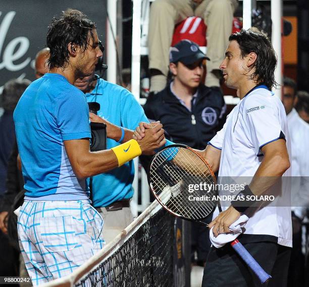 Spanish Rafael Nadal shakes hands with Spanish David Ferrer at the end of their ATP Tennis Open final match in Rome on May 2, 2010. Nadal won...