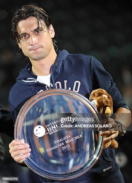 David Ferrer poses for photographers with his trophy at the end of the ATP Tennis Open match in Rome on May 2, 2010 in Rome. Nadal won 7-5 6-2. AFP...