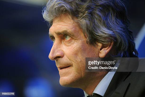 Real Madrid's manager Manuel Pellegrini looks out from the dug out before the start of the La Liga match between Real Madrid and CA Osasuna at...