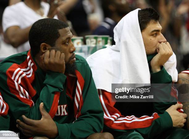 Guard John Salmons and Forward Carlos Delfino of the Milwaukee Bucks watch the closing minutes of Game Seven of the Eastern Conference Quarterfinals...