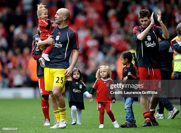 Pepe Reina and other Liverpool players walk on the pitch with their children following the final home game of the year during the Barclays Premier...