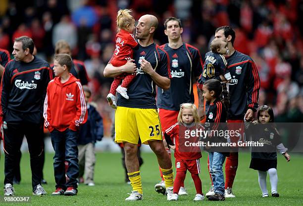 Pepe Reina and other Liverpool players walk on the pitch with their children following the final home game of the year during the Barclays Premier...
