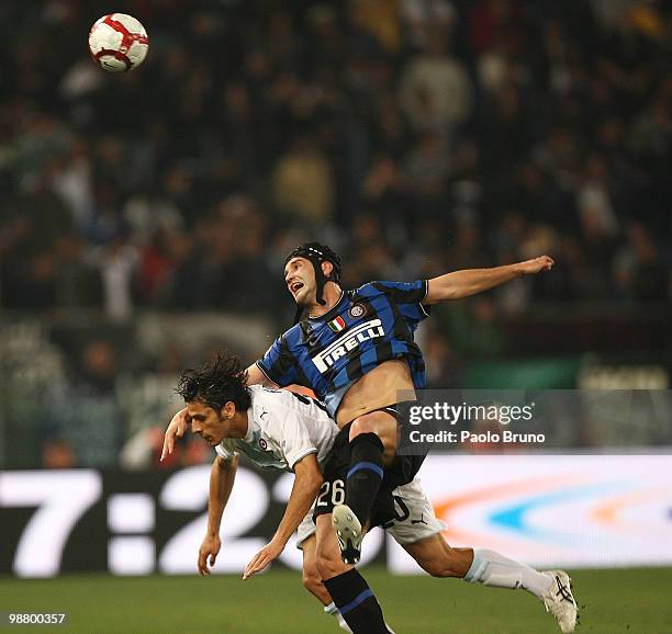 Cristian Chivu of FC Internazionale Milano and Sergio Floccari of SS Lazio compete for the ball during the Serie A match between SS Lazio and FC...