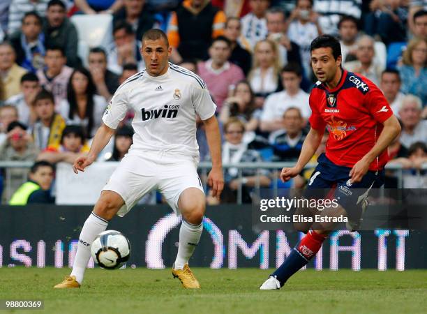 Karim Benzema of Real Madrid gives a pass during the La Liga match between Real Madrid and CA Osasuna at Estadio Santiago Bernabeu on May 2, 2010 in...