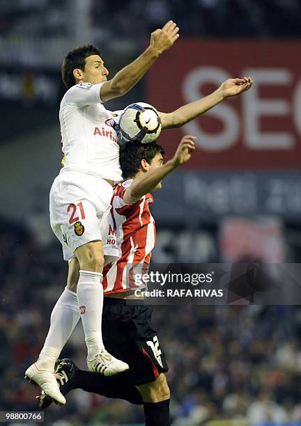 Athletic Bilbao's Mikel San Jose jumps for the ball with Mallorca's Aritz Aduriz during a Spanish league football match, on May 2 at San Mames...