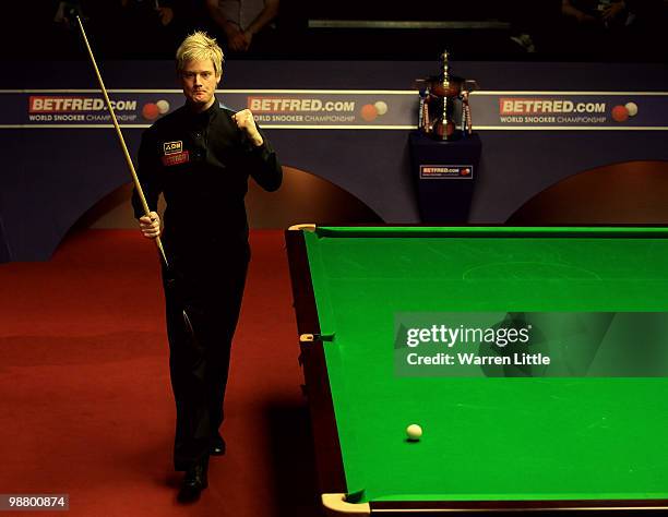 Neil Robertson of Australia celebrates winning the 11th frame against Graeme Robertson of Scotland during the final of the Betfred.com World Snooker...