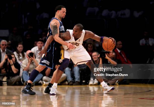 Kobe Bryant of the Los Angeles Lakers controls the ball against Deron Williams of the Utah Jazz during Game One of the Western Conference Semifinals...