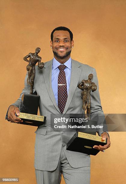 LeBron James of the Cleveland Cavaliers receives the Maurice Podoloff Trophy as the 2009-10 NBA Most Valuable Player presented by Kia Motors on May...