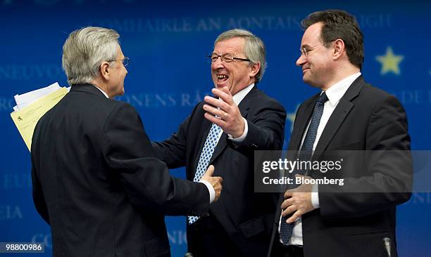 Jean-Claude Trichet, president of the European Central Bank , left, Jean-Claude Juncker, Luxembourg's prime minister and president of the Eurogroup,...