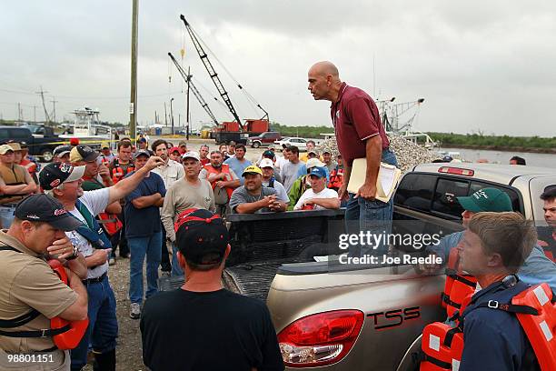 John Rahaim speaks with fishermen that will head out on their boats to help place oil booms into the water in an effort to protect the coast line...