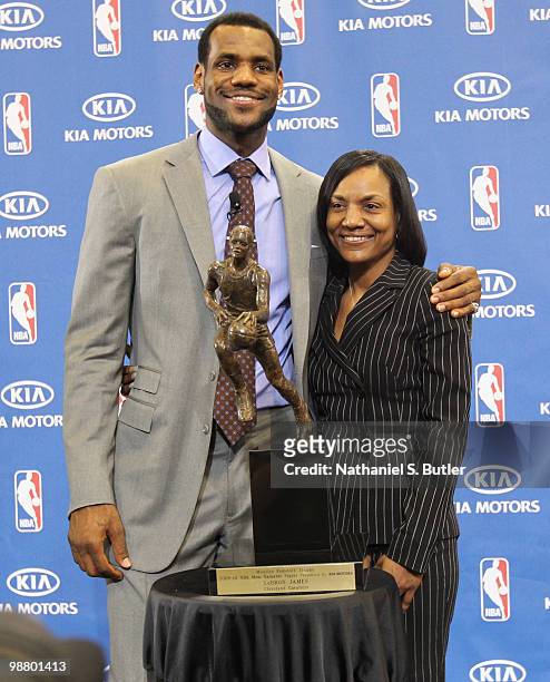 LeBron James of the Cleveland Cavaliers is joined by his mother Gloria James as he receives the Maurice Podoloff Trophy as the 2009-10 NBA Most...