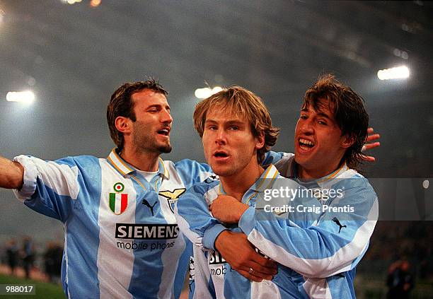 Pavel Nedved of Lazio is congratulated by team-mates after scoring during the UEFA Champions League match between Lazio and Real Madrid at the Stadio...