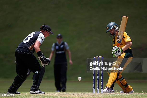 Jessica Cameron of Australia looks back as the ball narrowly misses the stumps as wicketkeeper Rachel Priest looks on during the ICC T20 Women's...