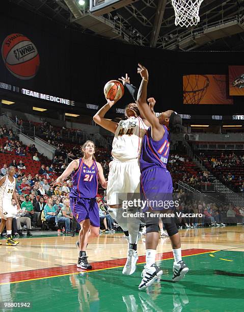 Ashley Walker of the Seattle Storm goes to the basket against Sequoia Holmes of the Phoenix Mercury during the game on May 2, 2010 at Key Arena in...