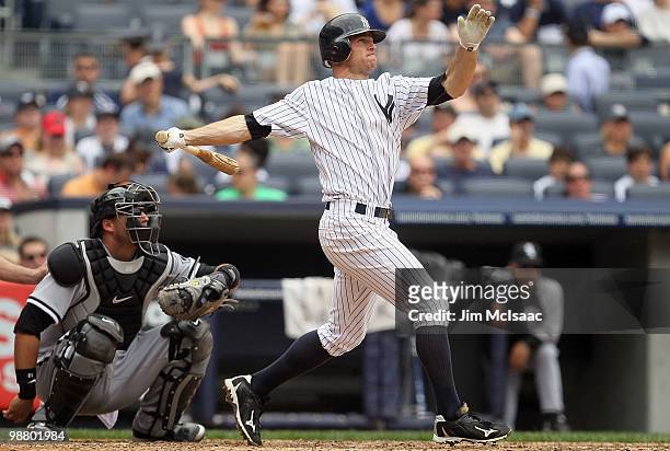 Brett Gardner of the New York Yankees follows through on a fourth inning home run against the Chicago White Sox on May 2, 2010 at Yankee Stadium in...