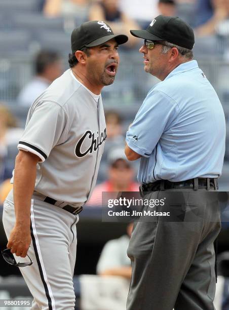 Manager Ozzie Guillen of the Chicago White Sox gets in a few last words with first base umpire Dale Scott after being ejected from the game against...