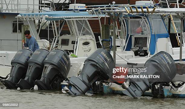 Charter boat operator cleans his boat at a Venice Marina after a commercial and recreational fishing ban was imposed on oil affected areas following...