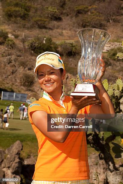Ai Miyazato of Japan poses with the champion's trophy following the fourth round of the Tres Marias Championship at the Tres Marias Country Club on...