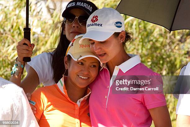 Ai Miyazato of Japan embraces Lorena Ochoa of Mexico after the fourth round of the Tres Marias Championship at the Tres Marias Country Club on May 2,...