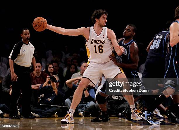 Pau Gasol of the Los Angeles Lakers controls the ball against Paul Millsap of the Utah Jazz during Game One of the Western Conference Semifinals of...