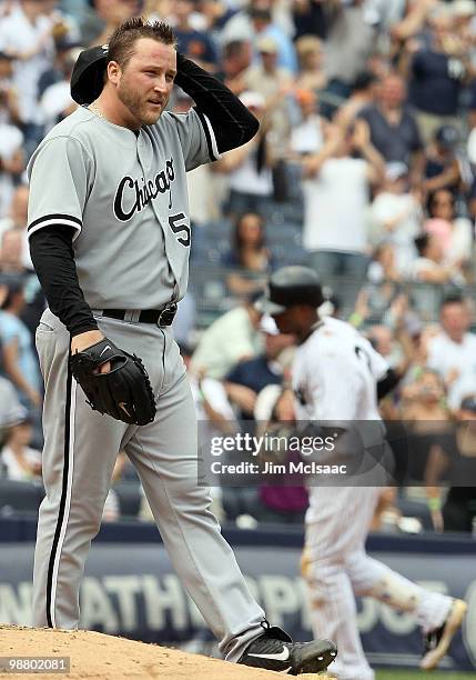 Mark Buehrle of the Chicago White Sox looks on after surrendering a fifth inning three run home run to Robinson Cano of the New York Yankees on May...