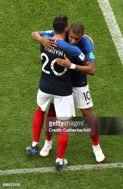 Florian Thauvin and Kylian Mbappe of France embrace in celebration of their victory following the 2018 FIFA World Cup Russia Round of 16 match...