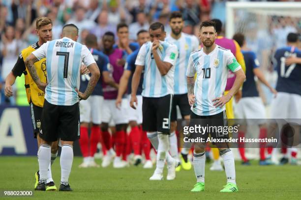 Lionel Messi of Argentina and fellow team mates look dejected following the 2018 FIFA World Cup Russia Round of 16 match between France and Argentina...
