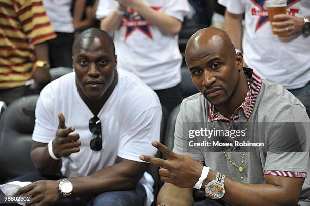 Takeo Spikes and Deon Grant attend the Milwaukee Bucks vs. Atlanta Hawks Game 7 Playoff game at Philips Arena on May 2, 2010 in Atlanta, Georgia.