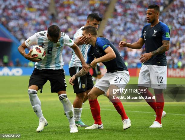 Sergio Aguero of Argentina clashes with Lucas Hernandez of France during the 2018 FIFA World Cup Russia Round of 16 match between France and...