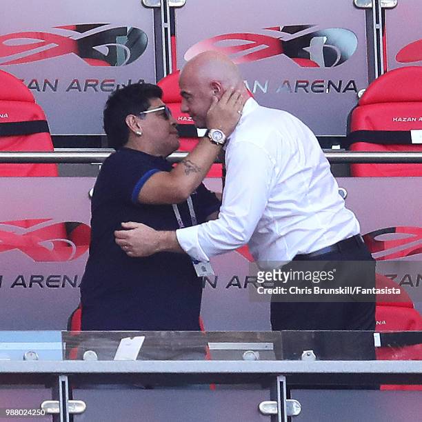 Diego Maradona embraces FIFA President Gianni Infantino following the 2018 FIFA World Cup Russia Round of 16 match between France and Argentina at...