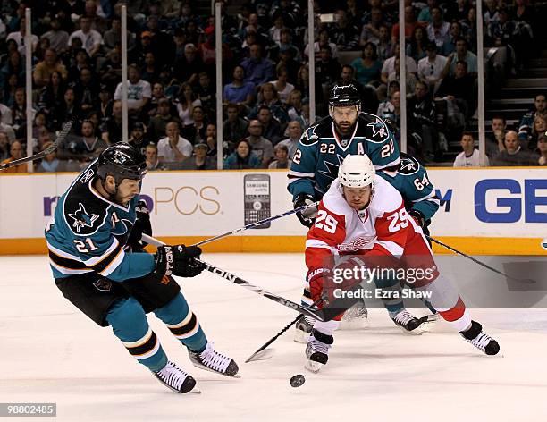 Scott Nichol of the San Jose Sharks and Jason Williams of the Detroit Red Wings go for the puck in Game Two of the Western Conference Semifinals...