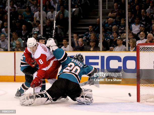 Evgeni Nabokov of the San Jose Sharks makes a save on a shot taken by Justin Abdelkader of the Detroit Red Wings in Game Two of the Western...