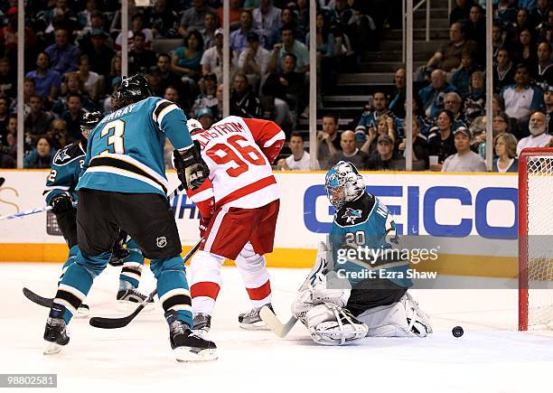 Tomas Holmstrom of the Detroit Red Wings scores a goal on Evgeni Nabokov of the San Jose Sharks in Game Two of the Western Conference Semifinals...