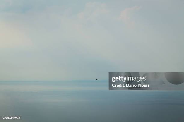 helicopter against the lake - nouri stock pictures, royalty-free photos & images