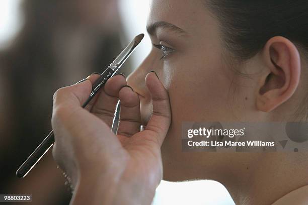 Model has make-up applied backstage ahead of the Lisa Ho show on the first day of Rosemount Australian Fashion Week Spring/Summer 2010/11 off-site at...