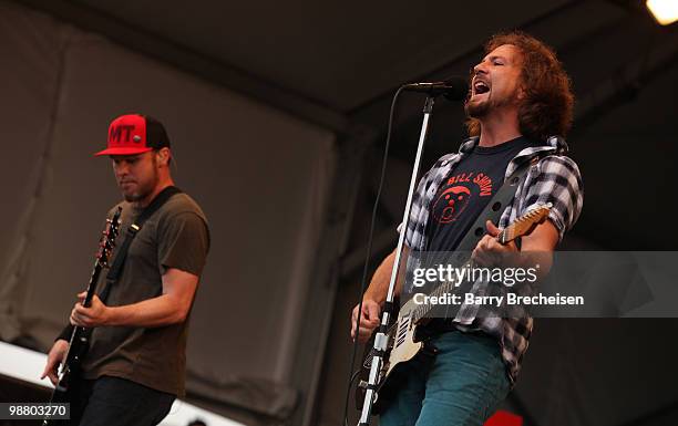 Bassist Jeff Ament and singer Eddie Vedder of Pearl Jam perform during Day 6 of the 41st annual New Orleans Jazz & Heritage Festival at the Fair...