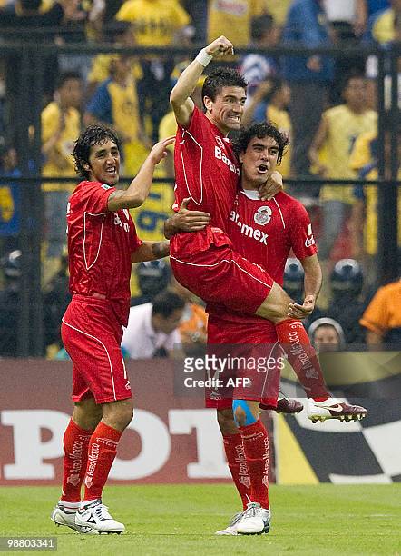Toluca's Hector Mancilla celebrates after scoring against America during their Mexican football league Bicentenary Tournament match in Mexico City on...
