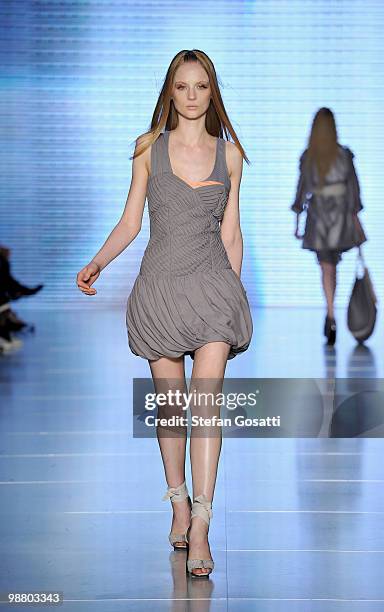 Model showcases designs by Ginger & Smart on the catwalk on the first day of Rosemount Australian Fashion Week Spring/Summer 2010/11 at the Overseas...