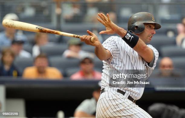 Jorge Posada of the New York Yankees doubles in the seventh inning against the Chicago White Sox on May 2, 2010 at Yankee Stadium in the Bronx...