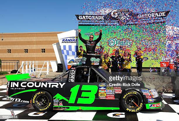 Johnny Sauter driver of the In Country TV Chevrolet celebrates in victory lane after winning the NASCAR Camping World Truck Series O'Reilly Auto...