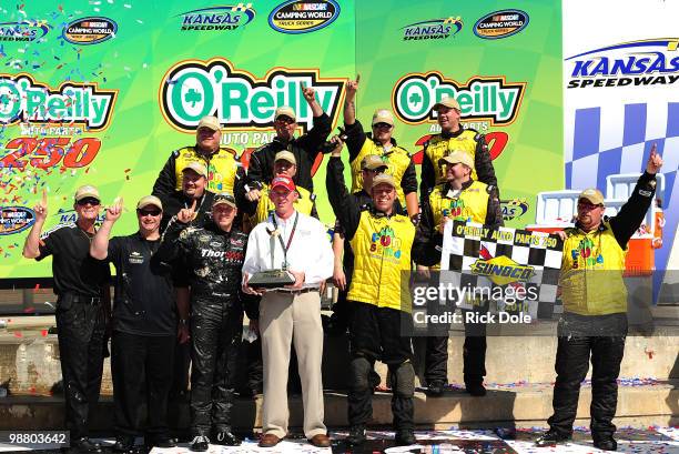 Johnny Sauter driver of the In Country TV Chevrolet and his crew celebrate in victory lane after winning the NASCAR Camping World Truck Series...