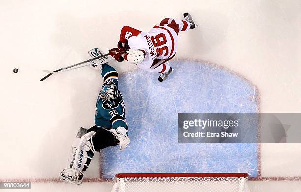 Tomas Holmstrom of the Detroit Red Wings is stopped by Evgeni Nabokov of the San Jose Sharks in Game Two of the Western Conference Semifinals during...