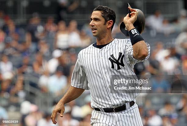 Jorge Posada of the New York Yankees reacts after flying out to end the third inning with the bases loaded against the Chicago White Sox on May 2,...