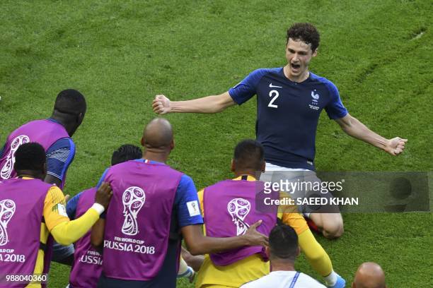 France's defender Benjamin Pavard celebrates after scoring his team's second goal during the Russia 2018 World Cup round of 16 football match between...