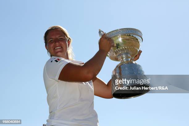 Leonie Harm of Germany with the trophy after winning the final on day five of The Ladies' British Open Amateur Championship at Hillside Golf Club on...